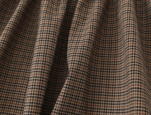 Detailed macro view of the premium plaid fabric texture on a women's shift dress