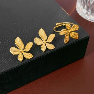 Golden floral jewelry set with brushed texture stud earrings and adjustable open ring