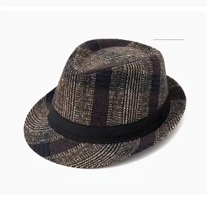 Close-up of coffee brown plaid fedora hat with elegant texture and decorative black band