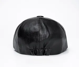 Detail of black PU leather beret hat featuring elastic adjustment and rich texture