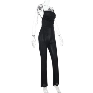 Side view of a sexy backless slim fit jumpsuit in black knit fabric for women