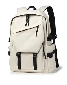 Detail view of cream-colored functional backpack with black straps and buckles for travel