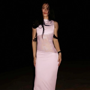 Detail of hollow lace splicing on the waist of a pink backless sleeveless maxi dress