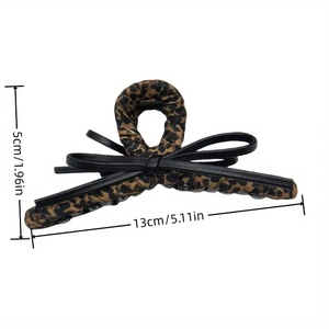 Elegant leopard print bow hair claw clip made of faux leather and fabric for women