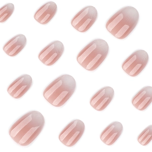 Elegant short round press-on nails featuring a nude and white gradient with shimmer finish