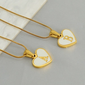 Golden heart necklace with shell inlay and initial A B on sleek snake chain for women