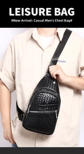 Men's black sling bag with woven texture showing front zipper detail on model