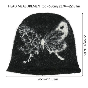 Flat lay of black knit beanie with white butterfly pattern and size measurements
