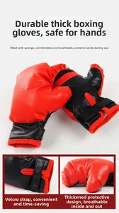 Detail of red and black boxing gloves showing high-elastic foam padding and Velcro strap