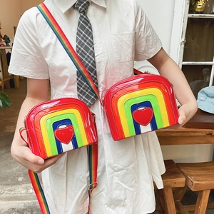 Rainbow heart-shaped crossbody bag in shiny patent leather with wide fabric strap