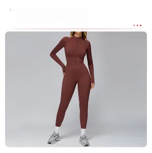 Detail of terracotta thermal yoga jumpsuit with half-zipper and slimming waist cut