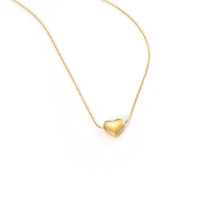 Close-up of a 3D gold heart pendant necklace with a delicate polished metal chain