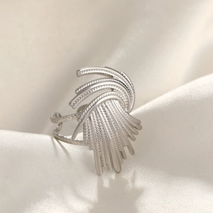 Modern silver hammer-textured stainless steel ring with a radial fan-shaped design