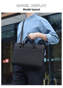 Detail of waterproof black business laptop bag with reinforced handles and shoulder strap