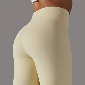 Detailed back view of high waist pale yellow yoga pants showing booty lift and seamless fit