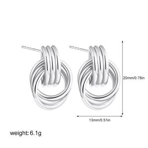 Detail view of 18K silver-plated multi-layer coiled earrings with size and weight specs
