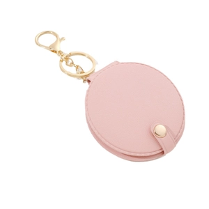 Pink PU leather round mini makeup mirror keychain with gold clasp on white background