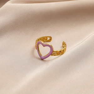 Detail of gold chain-style open ring with lavender enamel heart on champagne silk