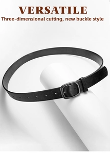 Close-up of a minimalist black faux leather belt with a vintage silver metal buckle