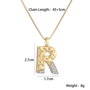 Detail view of two-tone gold letter R pendant necklace with zircon dimensions 2.7x1.7cm