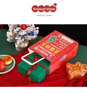 Festive red paper gift bag with Merry Christmas text and green box with red ribbon detail