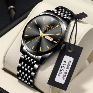 Macro shot of business quartz watch with black sunray dial and double calendar display