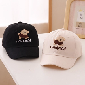 Close-up of breathable cotton canvas kids baseball caps with cute dog embroidery details