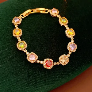 Vintage gold-plated bracelet featuring colorful square zircons and halo diamond accents