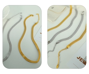 Detail of wide woven mesh necklace in gold and silver finish with adjustable clasp