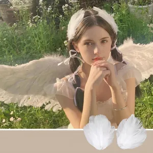 Elegant white feather angel wing hair clips with pearl details for ballet and cosplay