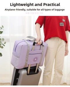 Purple travel bag detail showing the back slot attached to a silver suitcase handle