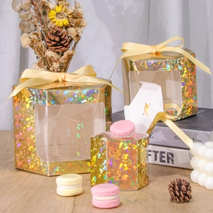 Three sizes of kraft laser gold hexagonal gift boxes with PET windows and macaroons