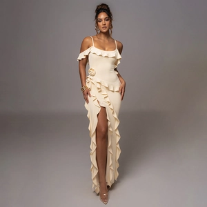 Detailed close-up of a beige off-shoulder long dress with elegant ruffle trim and high slit