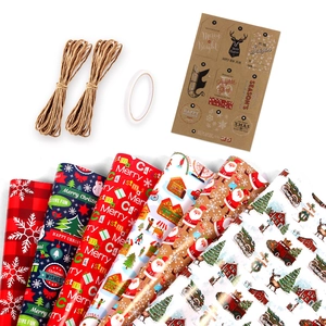 Christmas gift wrapping paper set with red snowflakes and trees plus twine and tags