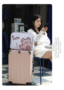 Pink striped suitcase and white bear cartoon print travel bag set in lifestyle street scene