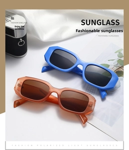 Detailed view of polarized square sunglasses in royal blue and transparent brown finish