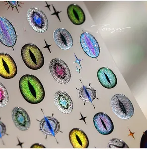 Macro detail of laser glitter evil eye nail stickers with stars and holographic finish