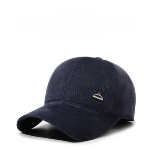 Detail showing the herringbone texture and metal mountain logo on this winter baseball cap