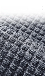 Detailed macro view of the anti-slip grooved texture on a durable rubber floor mat