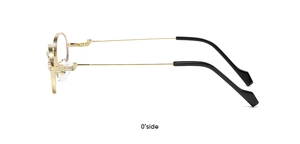 Detail of golden metal frame eyewear with black ear tips and decorative hinge design