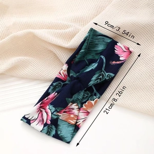 Detail view of floral printed yoga headband showing 9cm width and 21cm length dimensions