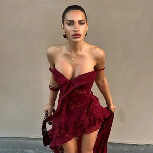 Detailed view of dark red lace dress featuring off-shoulder ruffles and sheer floral mesh