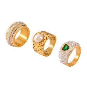 Luxe gold titanium rings with freshwater pearl, full crystals and green heart gemstone