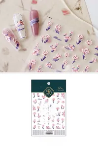 Macro shot of 5D floral embossed nail art stickers with purple flowers on nails