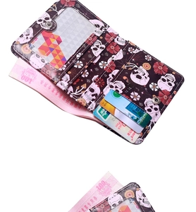 Detailed interior of skull and floral print bifold wallet showing multiple card slots