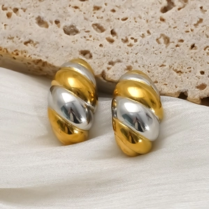 Two-tone 18K gold and silver twisted hoop earrings with textured spiral design
