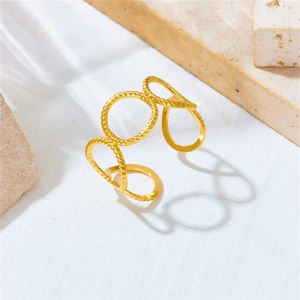 Detailed macro view of gold hollow geometric open ring with twisted rope texture