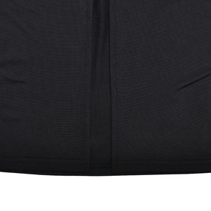 Macro shot of black knitted fabric texture and vertical seam detail on slim long dress