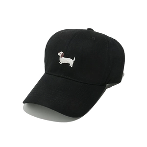 Close-up of the dachshund embroidery on a black cotton six-panel baseball cap