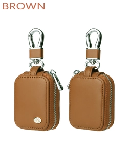 Detailed view of the brown leather zipper case with a sturdy metal hook and circular badge
